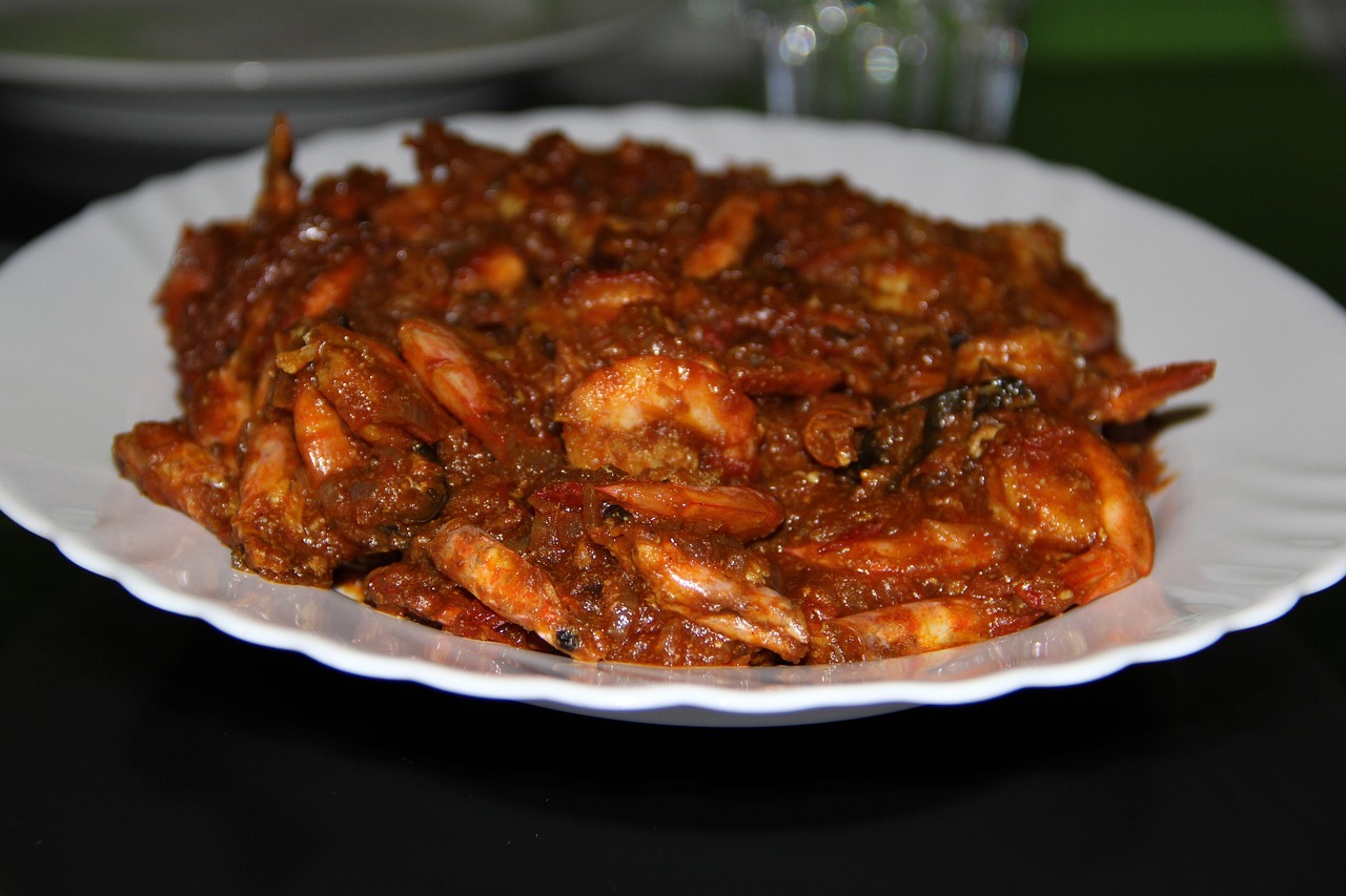 Spiced prawn curry served at the table