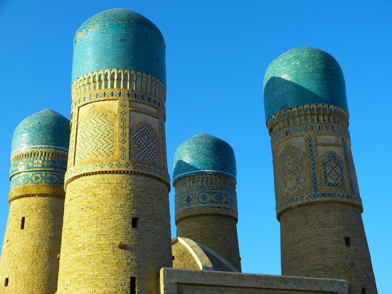 The four blue-capped towers of the Chor-Minor madrasa in Bukhara