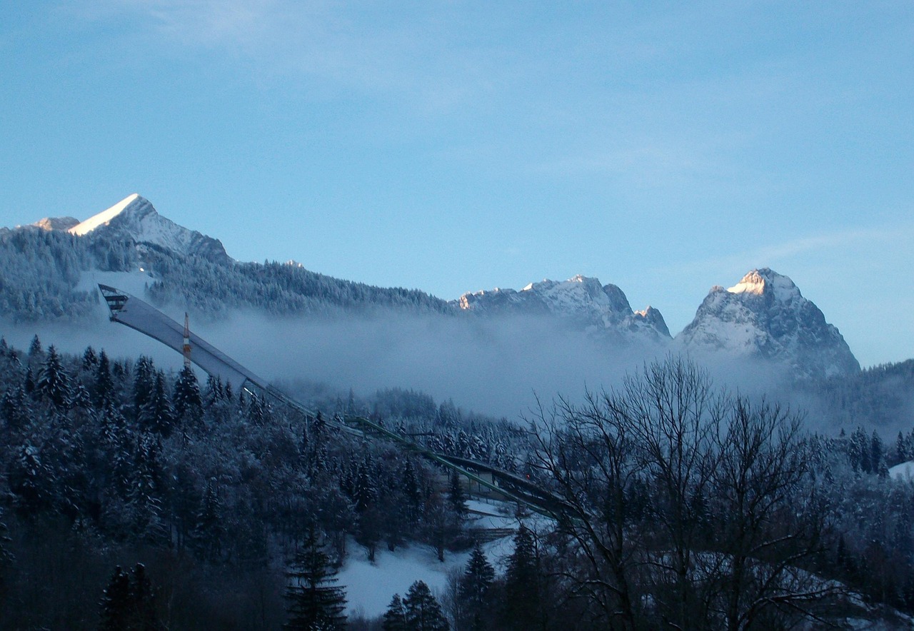 Ski jumping hill in a snowy alpine landscape