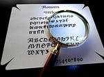 magnifying glass, calligraphy, larger view