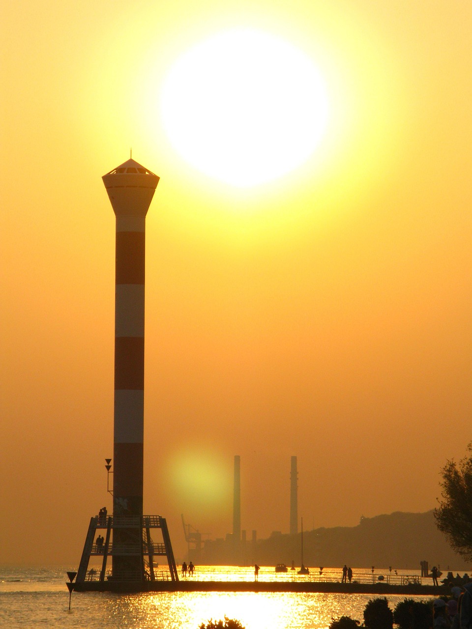 Download free HD stock image of Setting Sun Lighthouse Free Setting Sun Lighthouse photo and picture