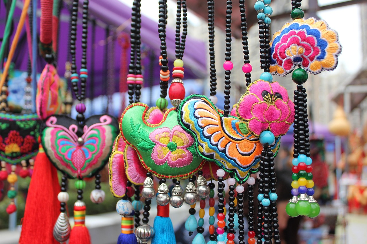 Intricate Chinese embroidery detail showing colourful silk threads in traditional accessory craft.