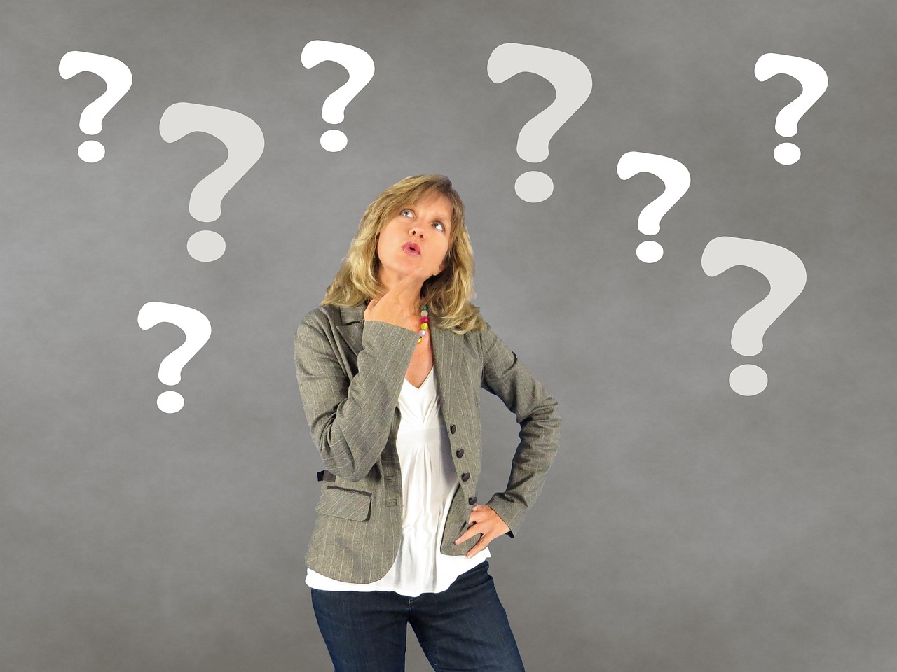 Elderly woman with a question mark graphic overlaid near her face.