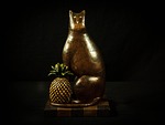 cat, pineapple, carved wood