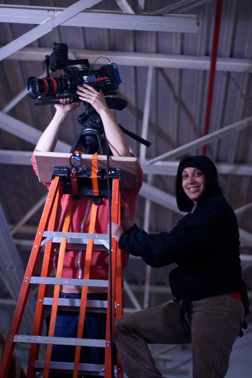 2 people working on a camera