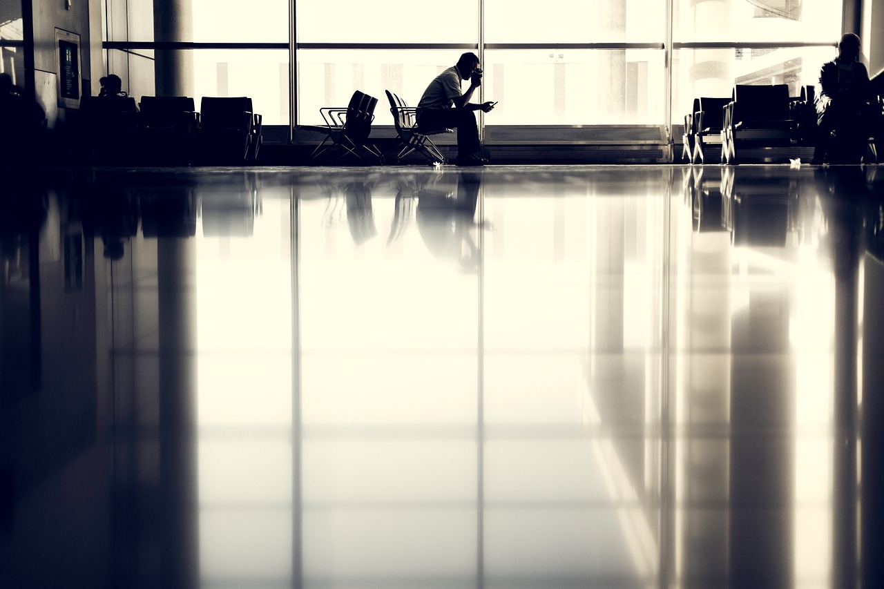 A traveler waiting in an airport terminal