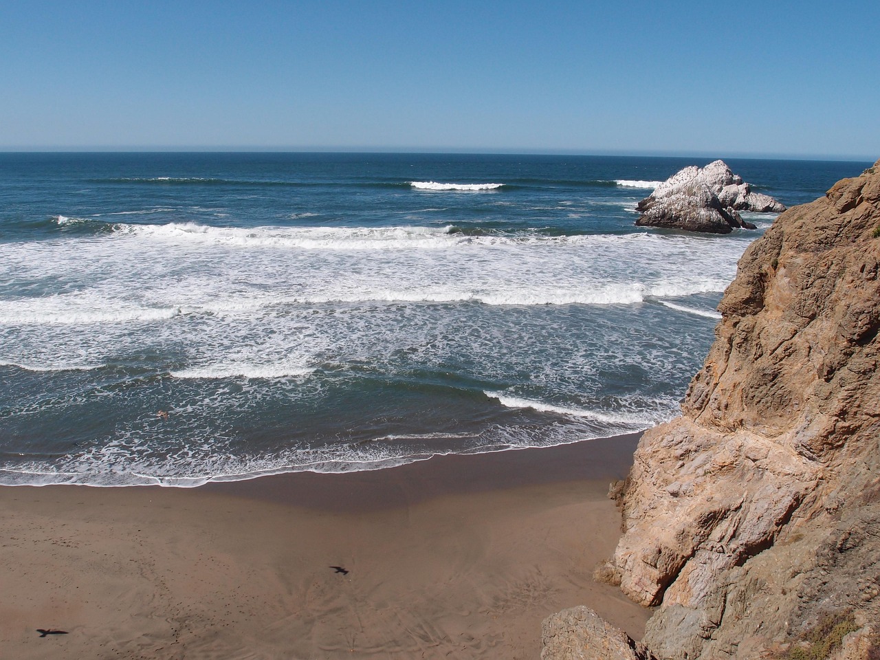 Rocky coastline and clear blue ocean water, natural landscape