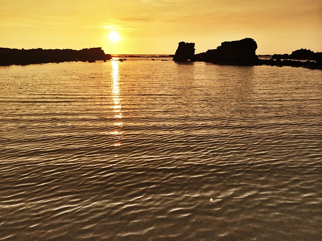 sunset, hawaii, pacific, ocean, water, sun, lava rocks, beach, hawaii beach, summer, vacation, travel, beach sunset, tropical, lifestyle, nature, sky, silhouette, island, hawaiian, outdoor, sand, relaxation, landscape