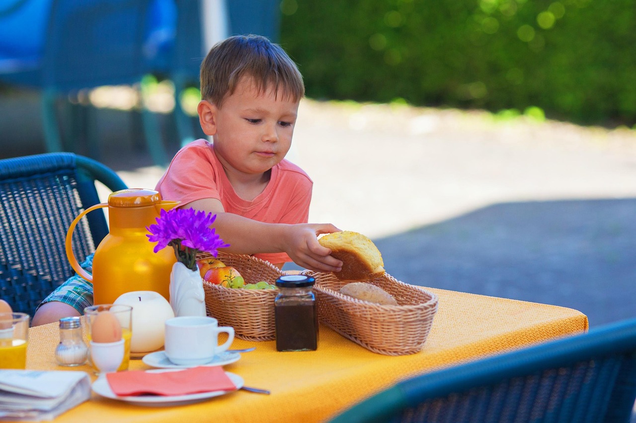 Children enjoying breakfast together
