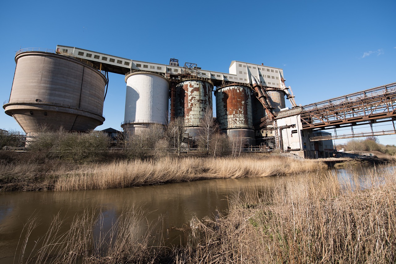 Industrial chemical plant with pipework and storage tanks where fluid-handling pumps are used