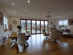 wood table, wood floors, bifold doors