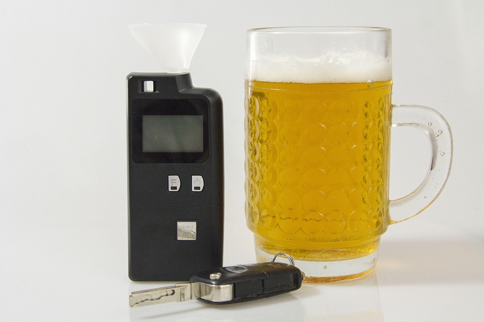 breathalyzer and a glass of alcohol