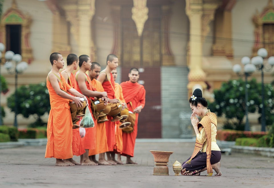 lady worshiping monks