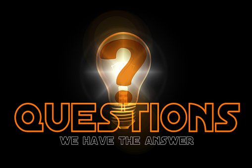 Drawing of a lit light bulb behind the word QUESTIONS and under it WE HAVE THE ANSWERS, all against a dark background