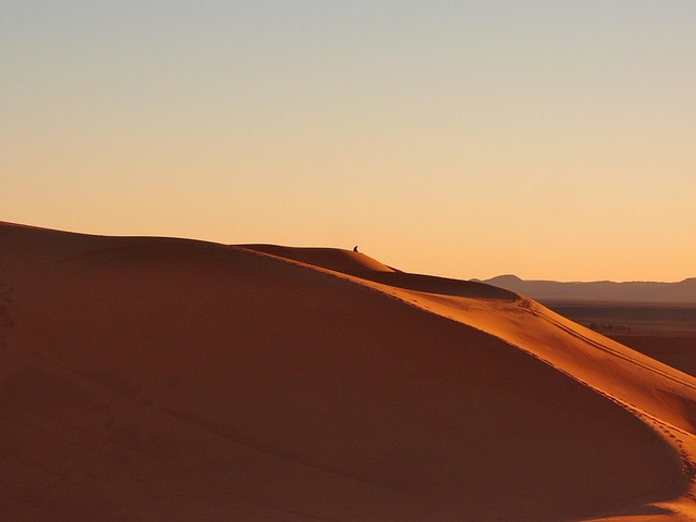 Sand dunes and kasbah architecture in Morocco