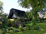 fountain, thatched roof, wagon wheel