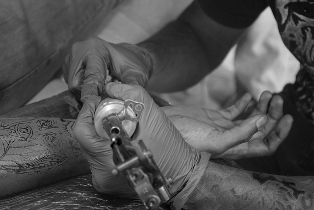 Free Tattoo Artist Tattooing photo and picture