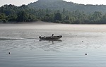 boater in fog, early morning, dawn