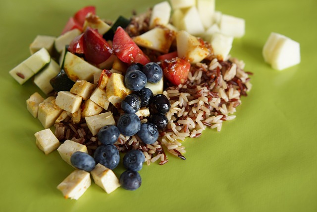 Poke bowl, mixed food, blueberries and rice — photo by elahaney