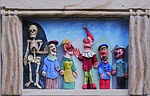 stone relief, a punch and judy show, punch