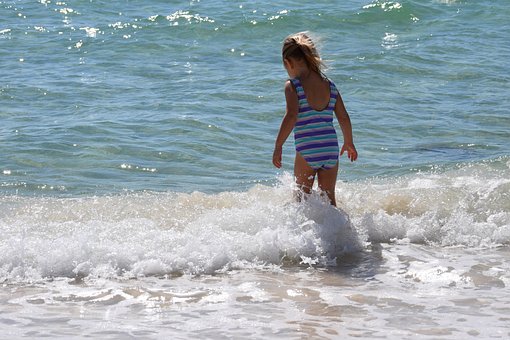 Free Child In The Surf Child photo and picture