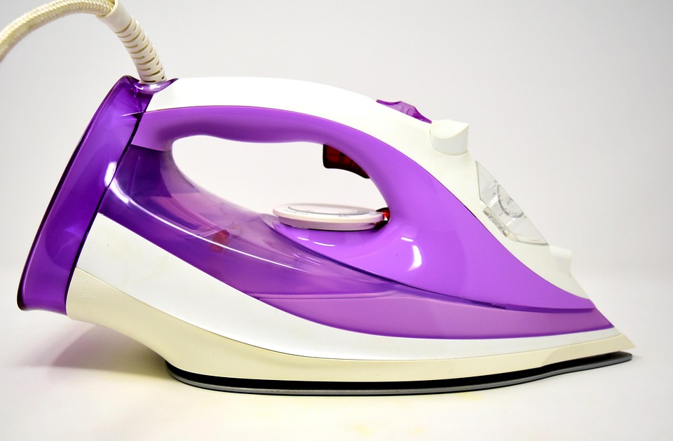 Purple and white clothing iron