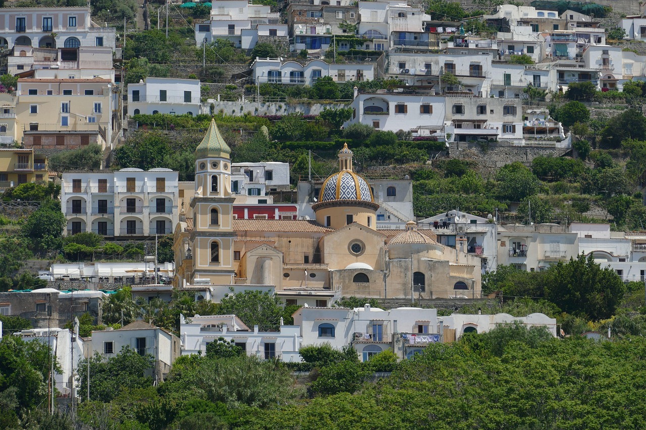 Positano village on the Amalfi Coast with pastel-colored buildings and fishing boats