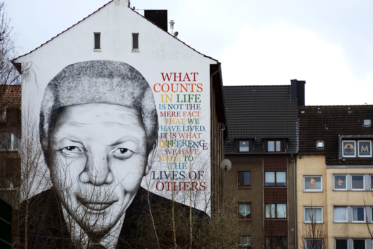 massive mural of Nelson Mandela with quote: "What counts in life is not the mere fact that we have lived. It is what difference we have made to the lives of others."