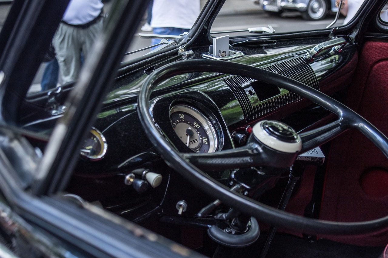 View of a bus steering wheel and dashboard gauges