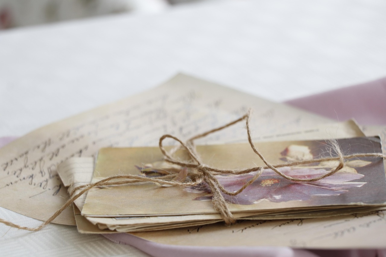Aged paper letter with faded handwritten text, yellowed at the edges.