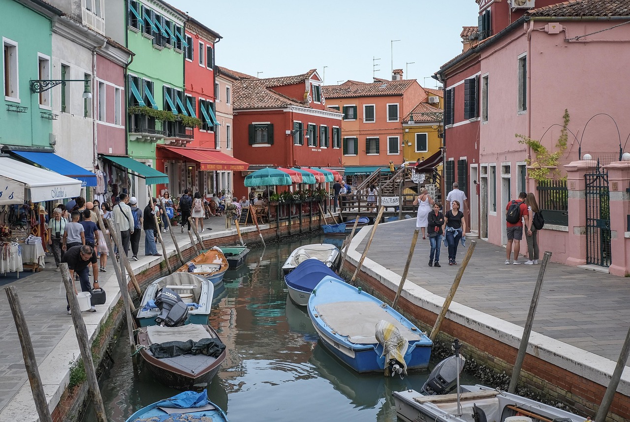 Colourful waterfront houses lining a canal in Burano, Italy