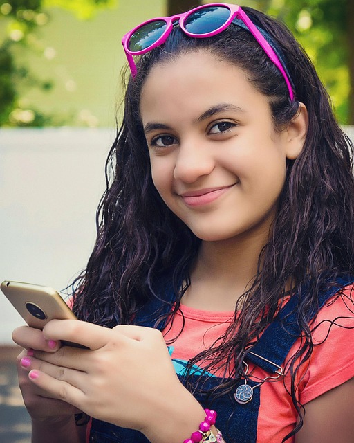 Free Girl With Smartphone Smiling photo and picture
