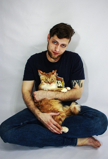 Free A Man With An Orange Cat photo and picture