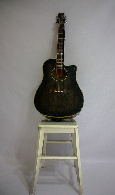 Free Brown Guitar Guitar On A High Chair photo and picture
