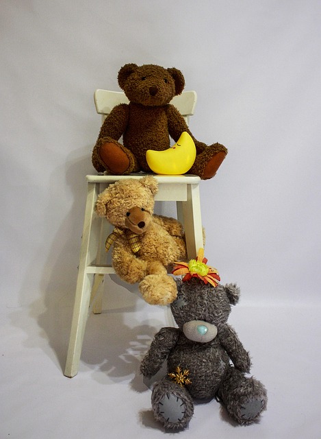 Free Three Teddy Bears Toys On A White Chair photo and picture