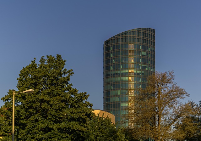 office building, trees, heaven, nature, architecture, building, modern, city, window, design, blue, glass, office, tower, high, exterior view, corporate, business, structure, company, property, perspective
