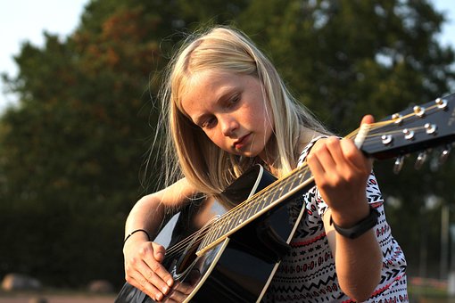 Free Little Girl Guitar Player photo and picture