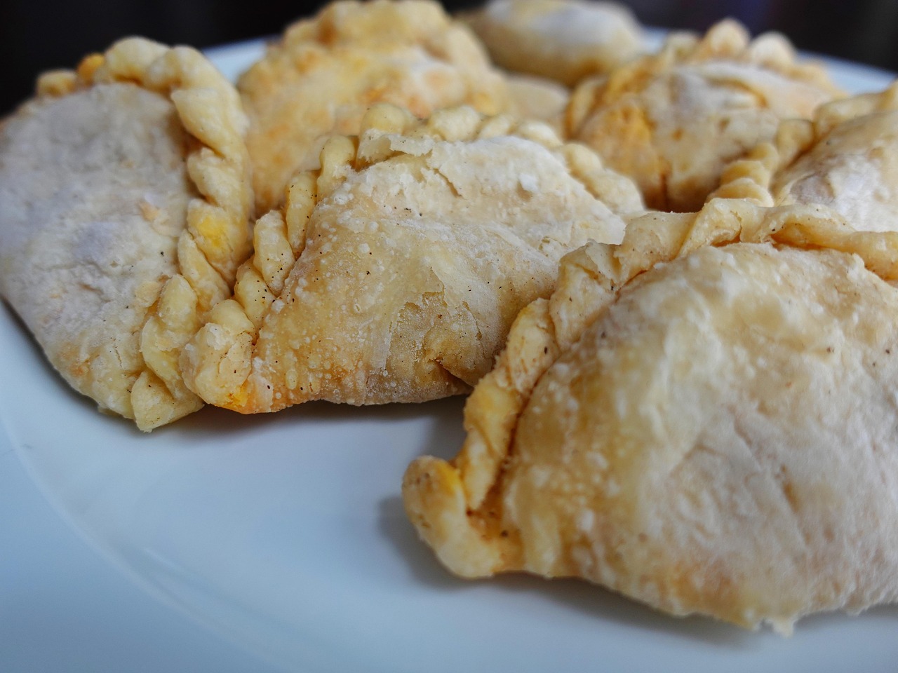Puff pastry squares with curry filling ready to fold