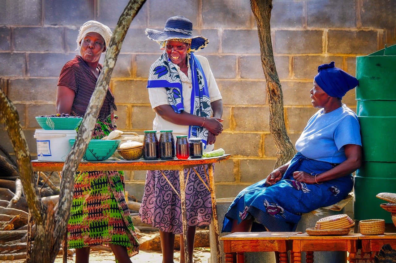 African women in conversation, one supporting the other through a difficult moment