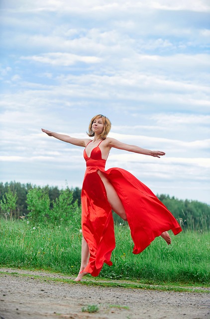 woman, model, red dress, dress, fashion, go over, jumping, long dress, style, stylish woman, young woman, women, fields, grass, meadow, landscape, nature, outdoors, joy, happiness, emotions, euphoria, jump for happiness, to be in the clouds, dream