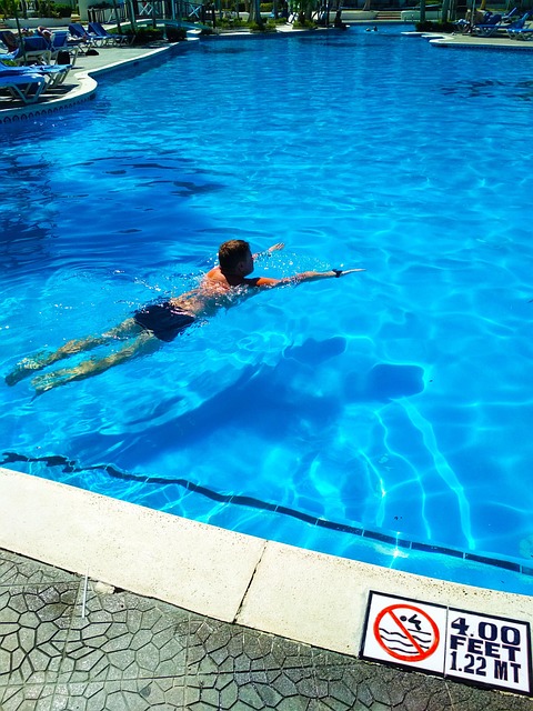 Free Tourist Swimming In The Pool photo and picture
