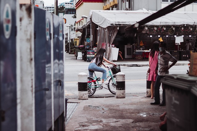 Women, bicycle, street and geylang street — photo by sgxp