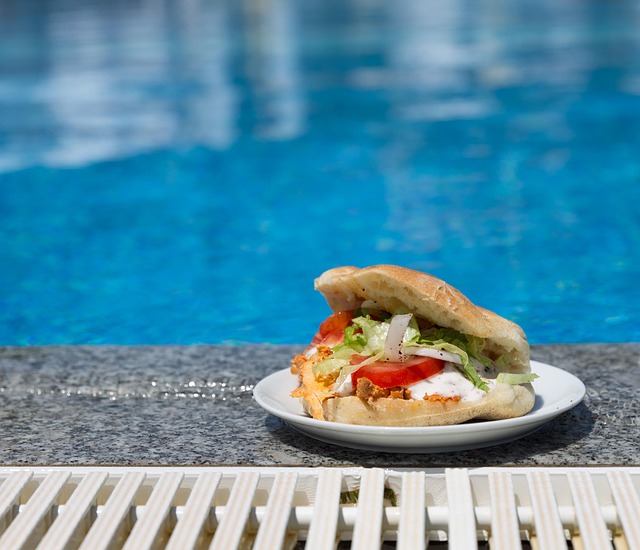 sandwich, food, swimming pool, resort, dish, leisure activity, outdoors, ciabatta, cuisine, bun