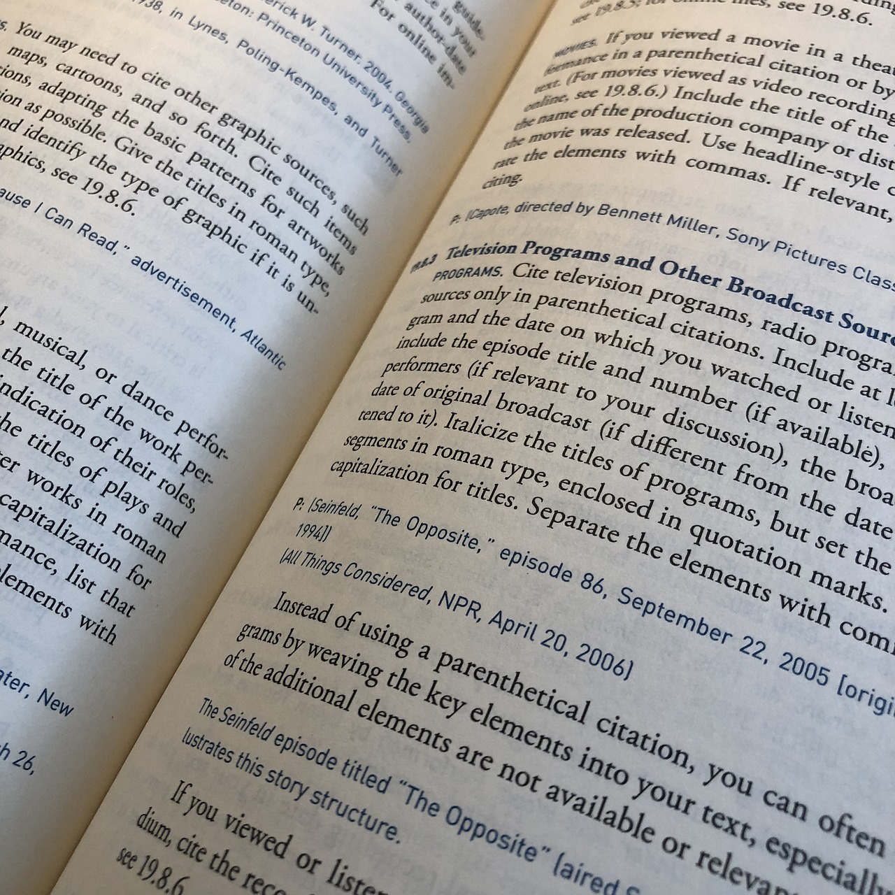 Open book showing footnotes and citation bibliography text on a printed page.