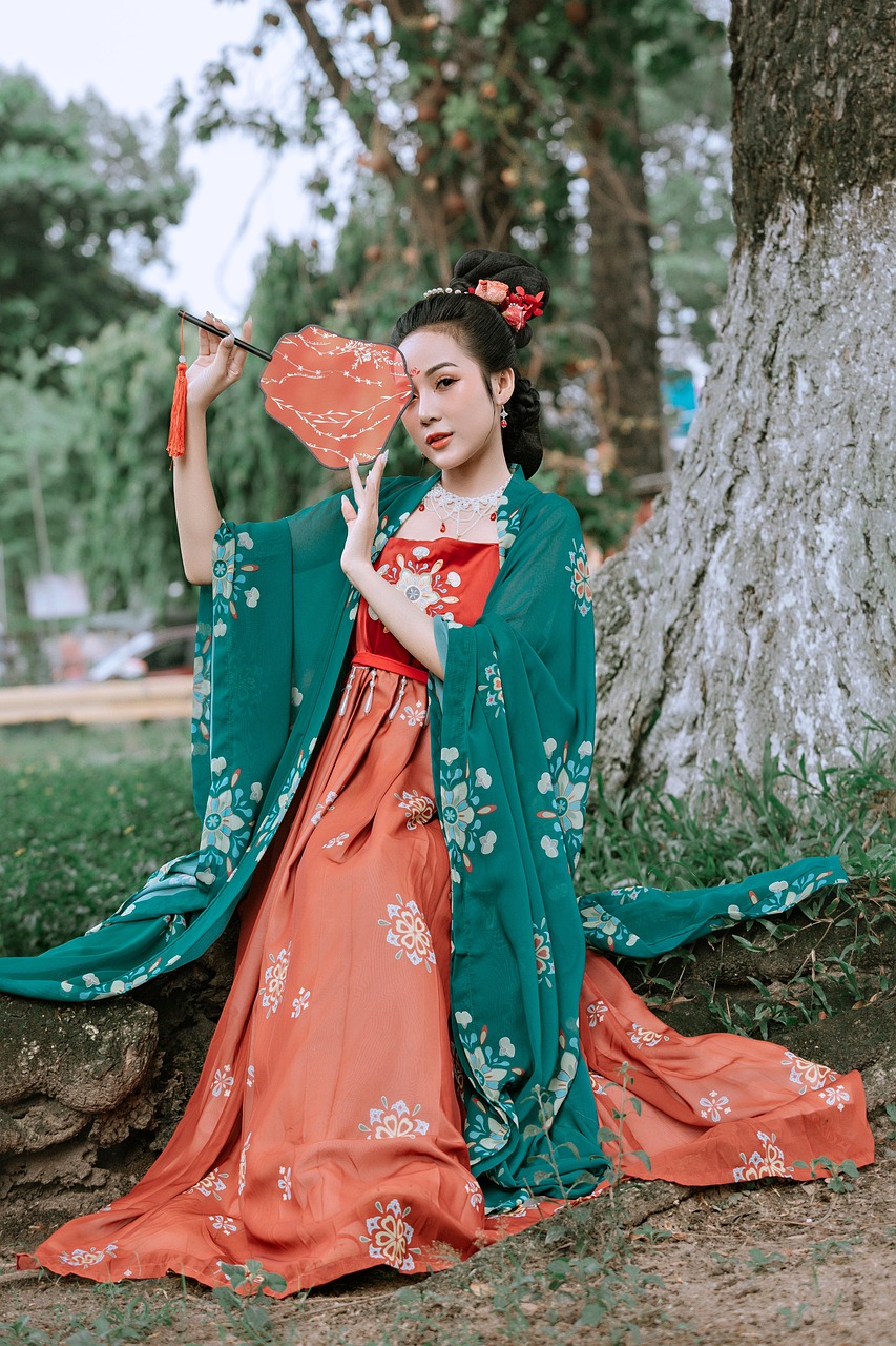 A woman wearing a traditional Chinese dress, embodying the elegance of cheongsam fashion.