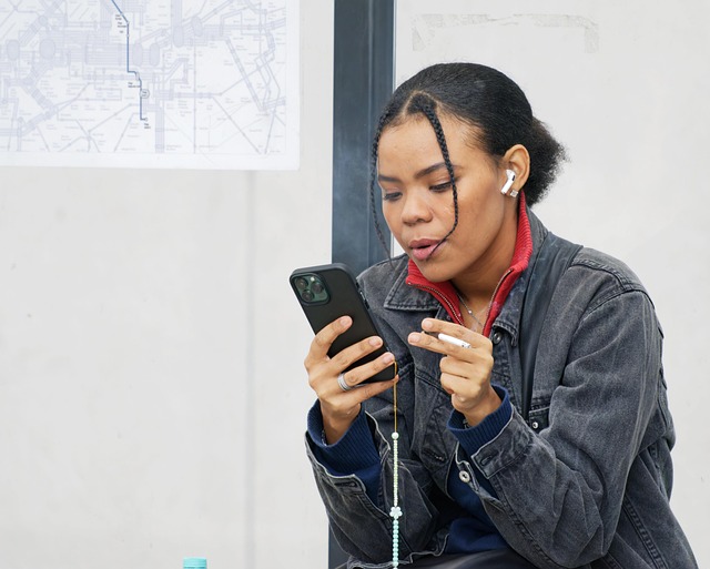 woman, cigarette, casual, looking, smartphone, waiting, sitting, bus station, urban, city, lifestyle