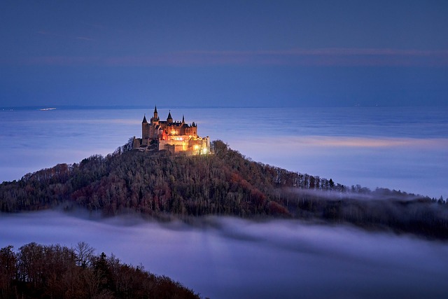 Castle, mountains, forest and fog — photo by Nordseher