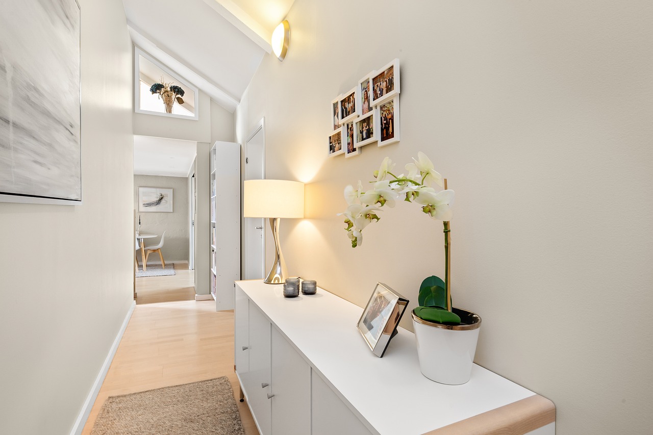 Clutter free minimalist entryway with woven basket storage and wall hooks
