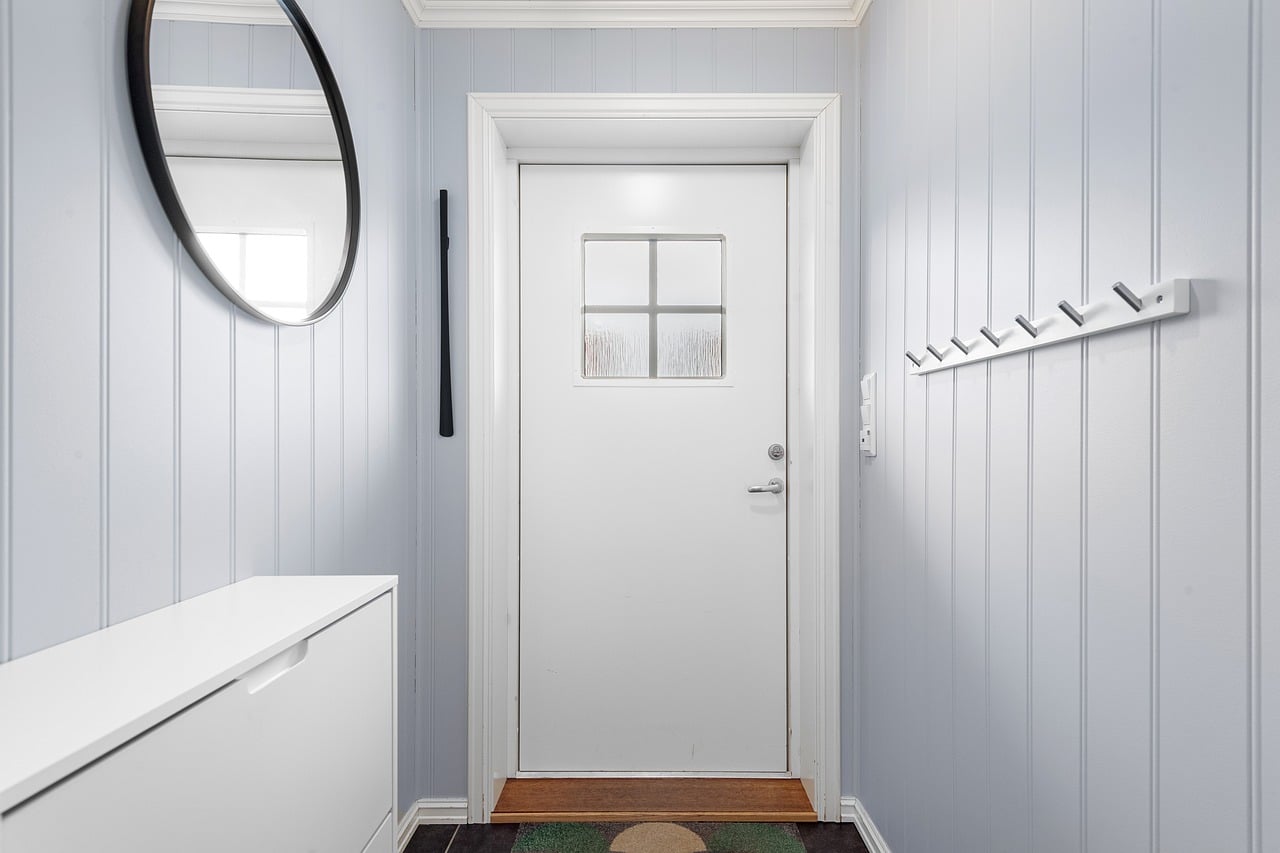 Small modern minimalist entryway with floating shelf and clutter free design