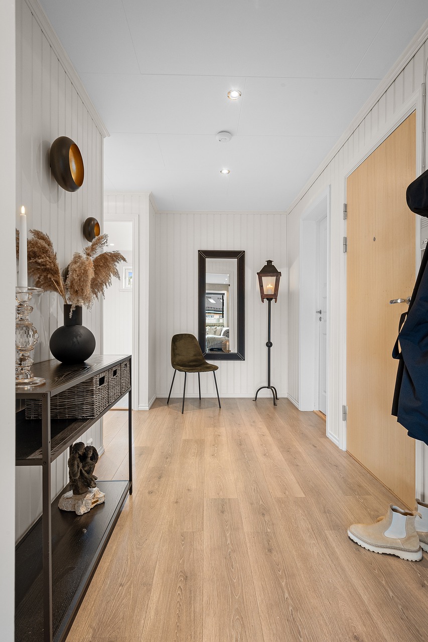 Minimalist entryway lighting ideas with warm wall sconces and mirror decor